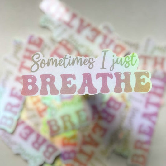 Sticker that Says: Sometimes I just breathe with “Sometimes I just” written in cursive and “Breathe” written in bubble print  background: white
